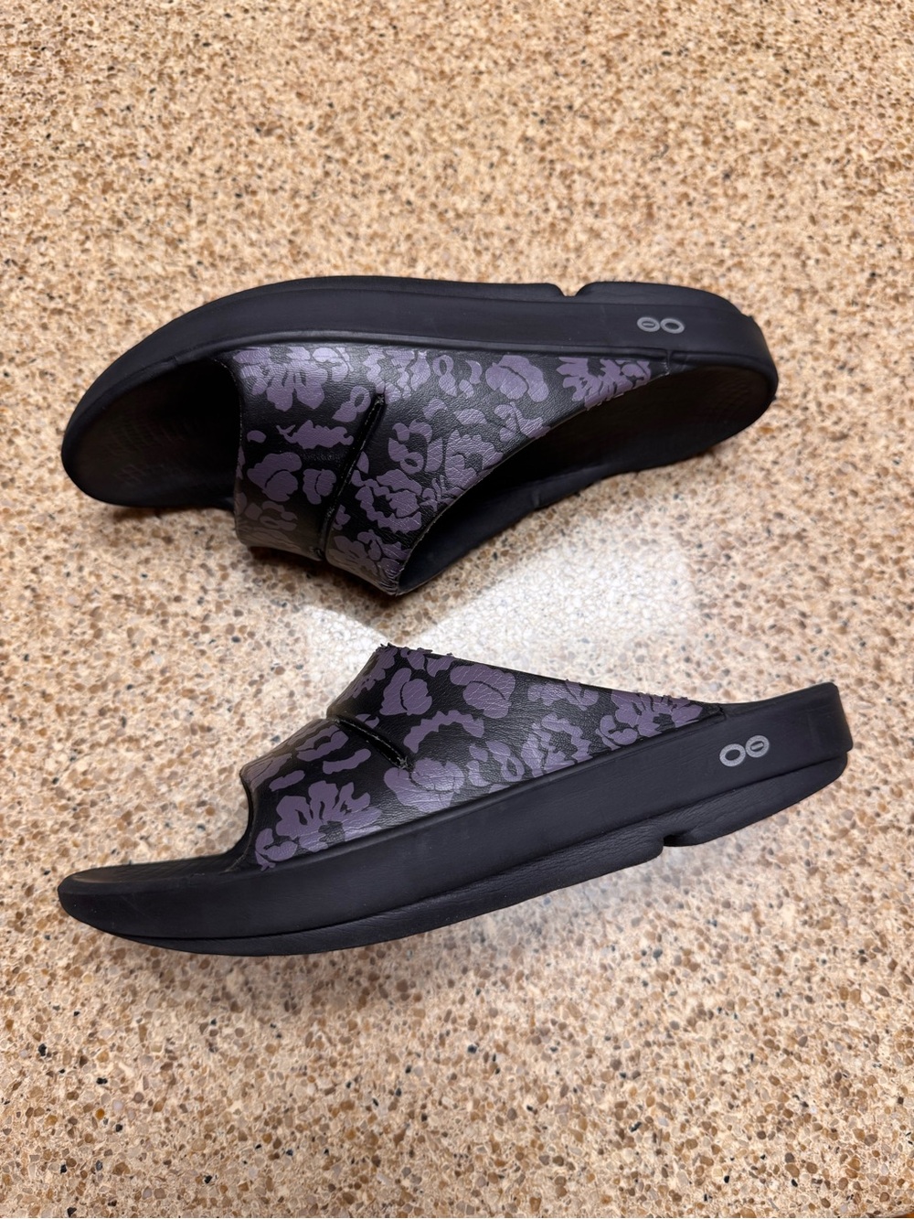 OOFOS Women's Black Slide Sandals with Purple Floral Accent